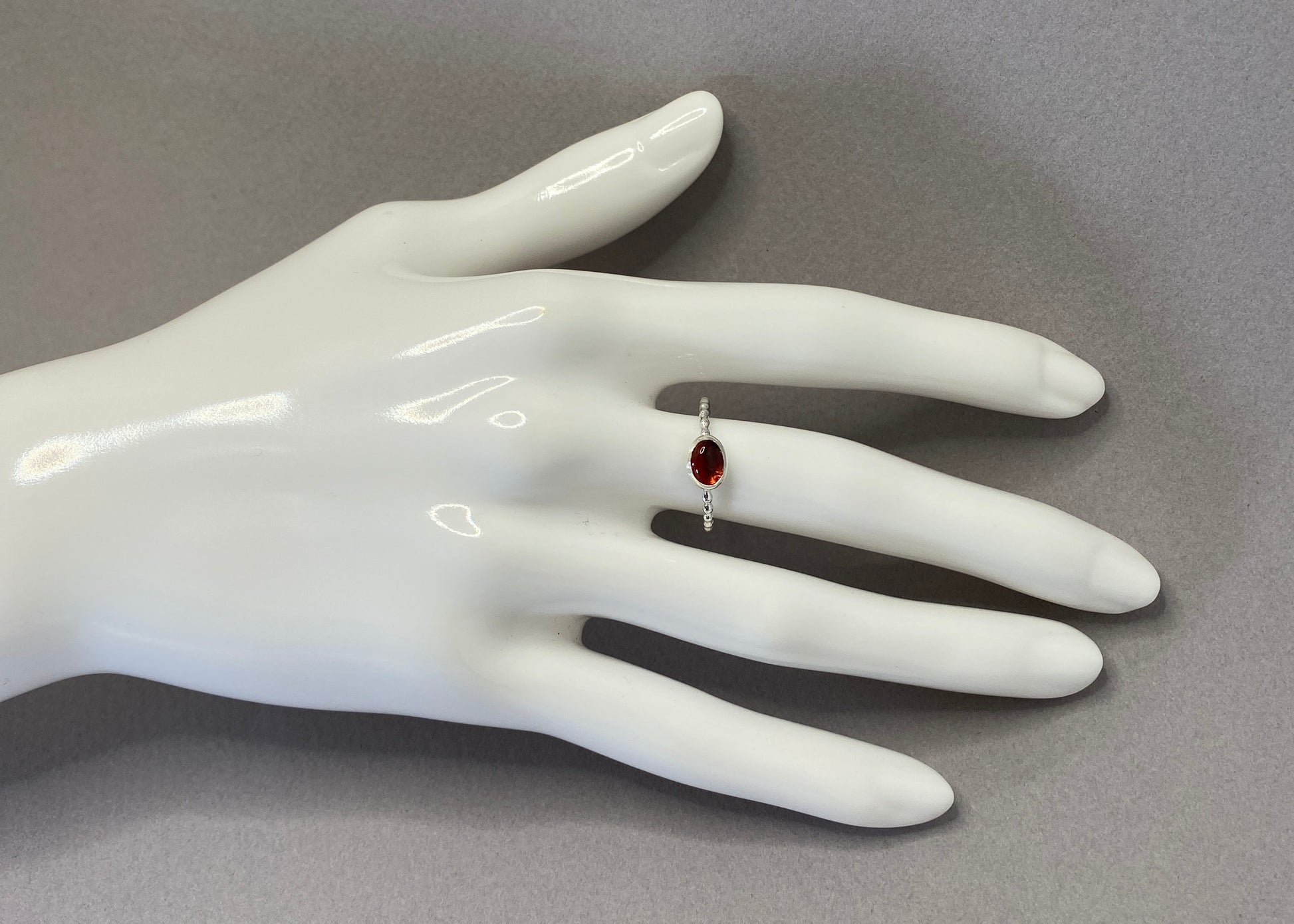 Red garnet gemstone ring with beaded sterling silver wire band