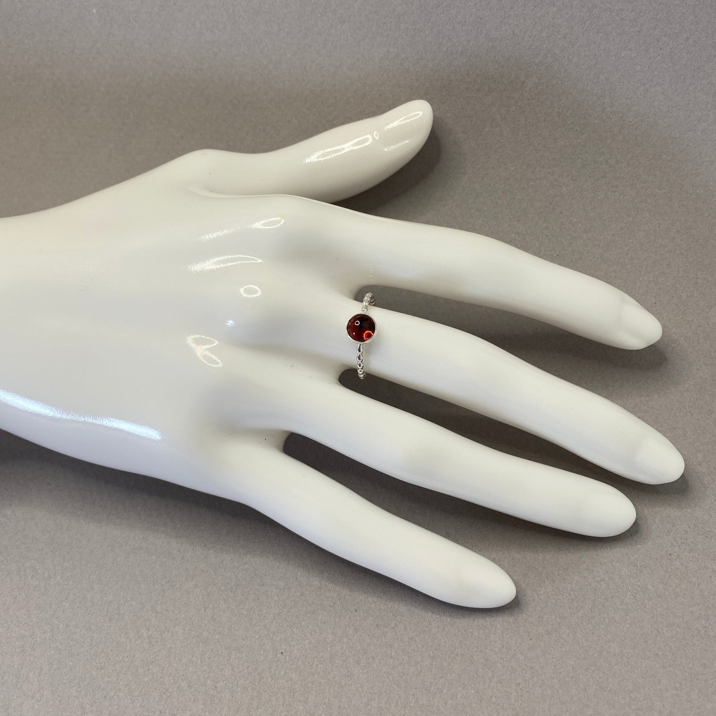 Red garnet gemstone ring with beaded sterling silver wire band
